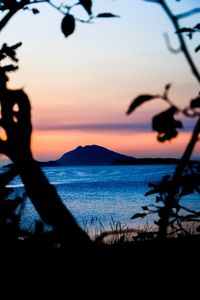 Scenic view of sea against clear sky during sunset