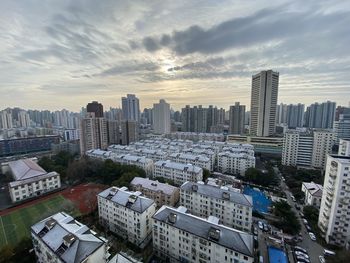 High angle view of buildings in city against sky