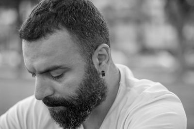 Close-up of thoughtful bearded man outdoors