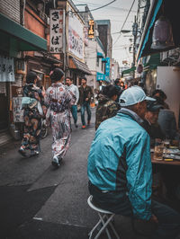 People on street market in city