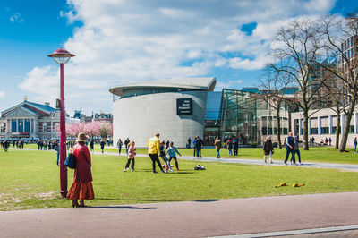 Group of people in front of buildings