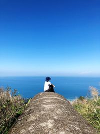 Scenic view of sea against blue sky