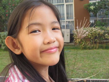 Close-up portrait of smiling girl