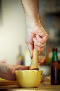 Close-up of person preparing food at home