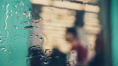 Close-up of water drops on car window