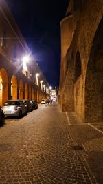 Cars on street in city at night