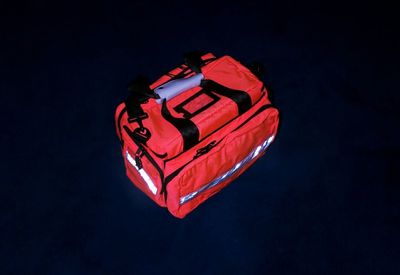 Close-up of red bag over black background