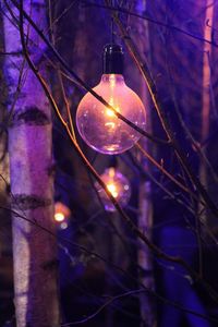 Low angle view of illuminated light bulb