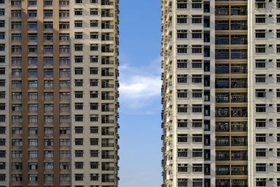 Low angle view of buildings in city against sky