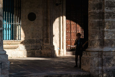 People standing at historical building