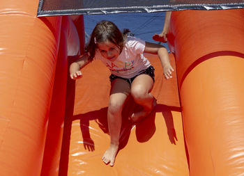 High angle view of girl lying down in water