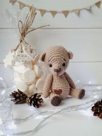 Close-up of stuffed toy and decoration on table