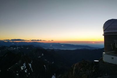 Scenic view of mountains against sky during sunset