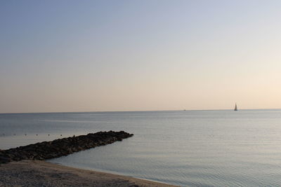 Scenic view of sea against clear sky during sunset