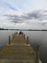 Pier over sea against sky