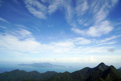 Scenic view of mountains against blue sky