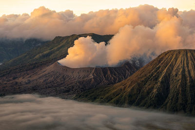 Panoramic view of volcanic landscape against sky during sunset