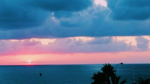 Scenic view of calm sea at sunset