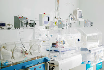 Newborn baby in hospital incubator