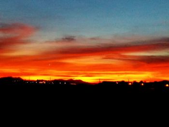 Silhouette of landscape against dramatic sky