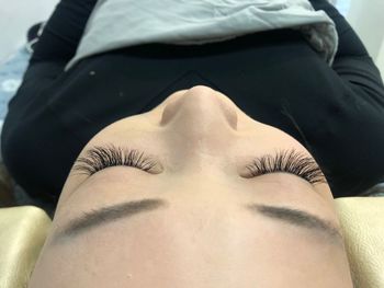 Close-up portrait of woman lying down