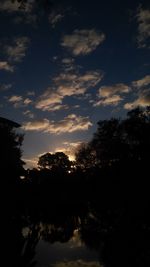 Scenic view of river at sunset