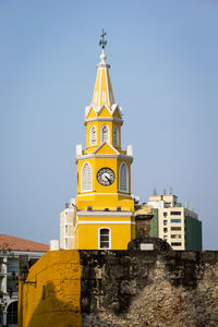 Low angle view of clock tower against sky