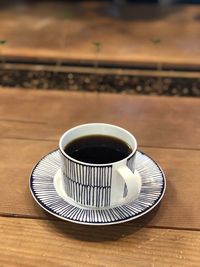 High angle view of coffee cup on table