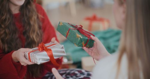 Midsection of woman holding gift