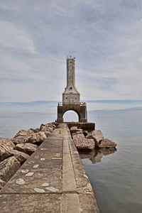 Castle by sea against sky