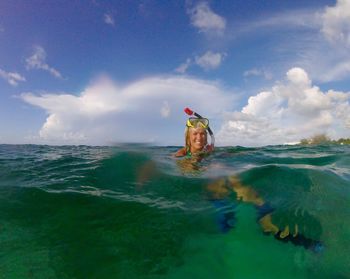 Scenic view of sea against cloudy sky