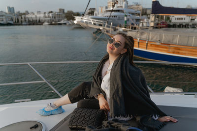 Portrait of young woman in boat