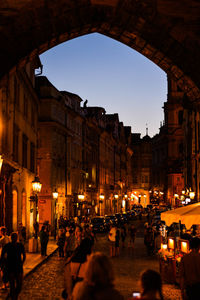 Group of people on street at dusk