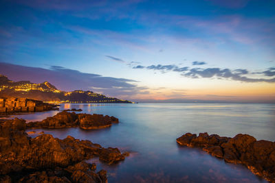 Scenic view of sea against sky at sunset