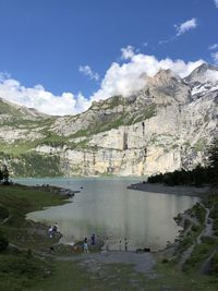 Scenic view of lake and mountains against sky