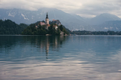 Scenic view of lake against cloudy sky