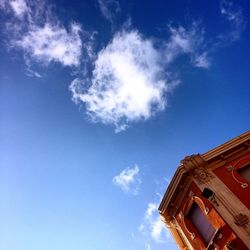 High section of building against blue sky