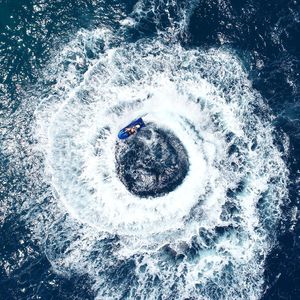 High angle view of man riding jet boat on sea