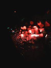 Defocused image of illuminated lights at night