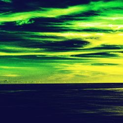 Scenic view of green landscape against sky