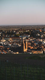 High angle view of buildings in city against clear sky