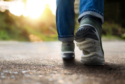 Low section of person standing outdoors