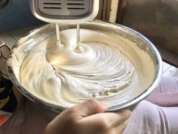 High angle view of person preparing food in bowl