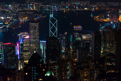 High angle view of city lit up at night
