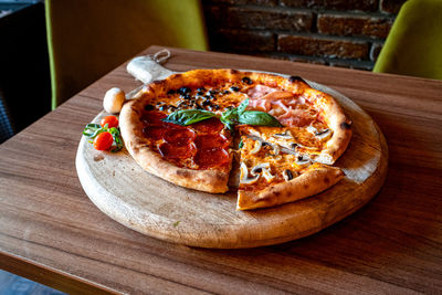 Close-up of pizza served on table