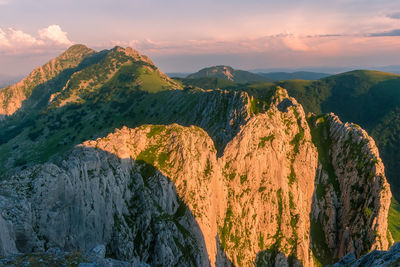 Scenic view of rock formation against sky during sunset