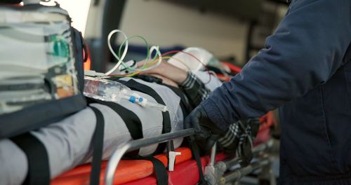 Midsection of man working in car