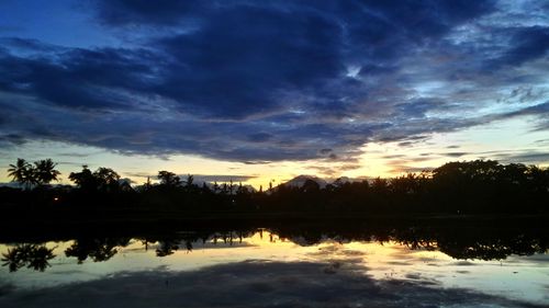 Reflection of clouds in lake during sunset