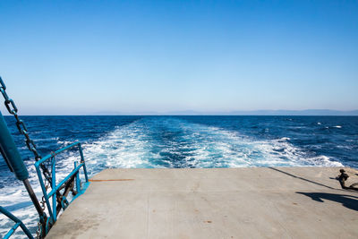 Scenic view of sea against clear blue sky
