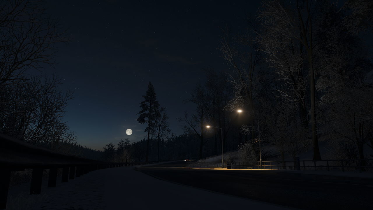 VIEW OF STREET LIGHTS AT NIGHT